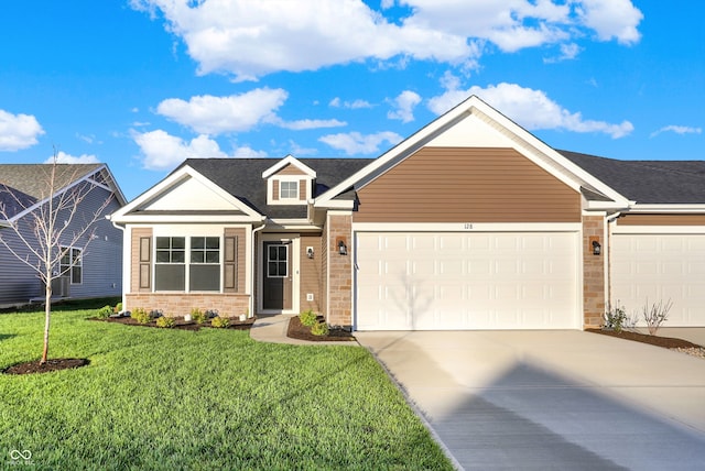 view of front of home featuring a front yard, brick siding, a garage, and driveway