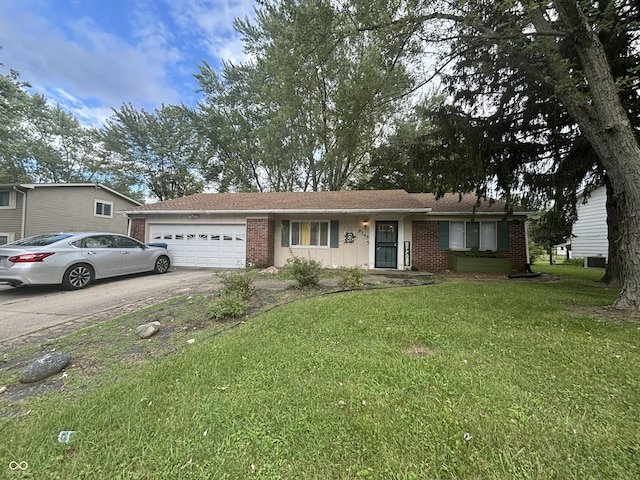 ranch-style house featuring a garage, a front yard, brick siding, and driveway