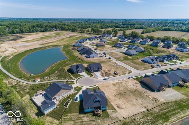 drone / aerial view with a water view and a residential view