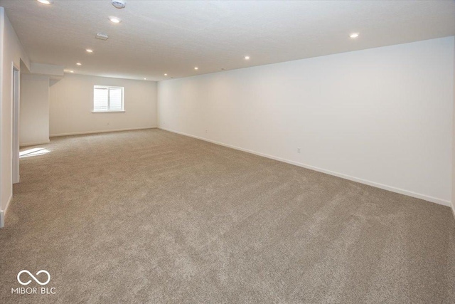 basement with light colored carpet