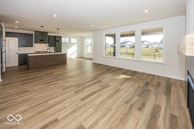 unfurnished living room featuring hardwood / wood-style floors