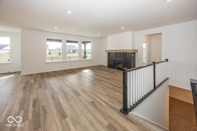 unfurnished living room with wood-type flooring