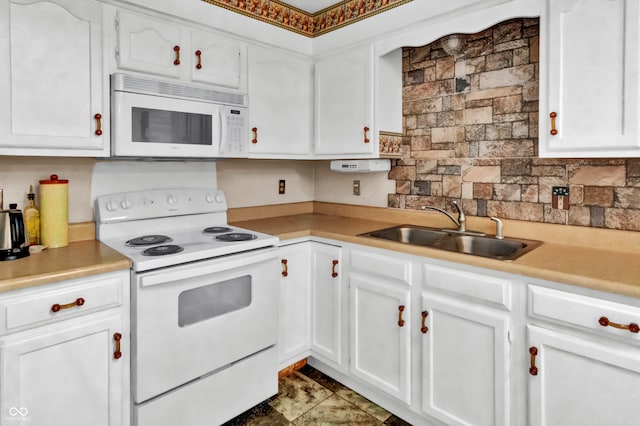 kitchen with decorative backsplash, white appliances, white cabinetry, and sink