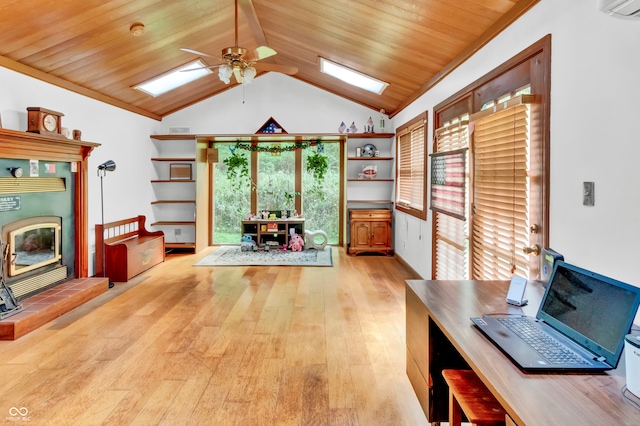 unfurnished office with ceiling fan, light hardwood / wood-style floors, wood ceiling, and lofted ceiling with skylight