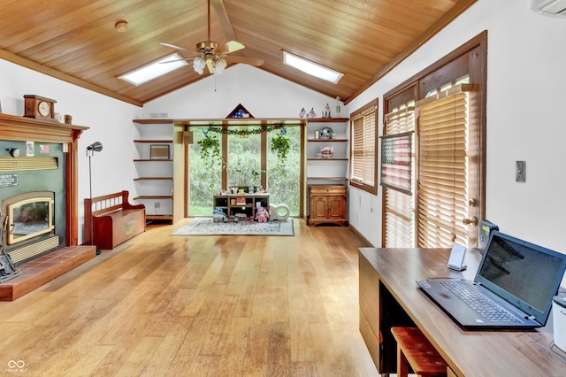 office with wood ceiling, a ceiling fan, vaulted ceiling with skylight, and light wood-type flooring
