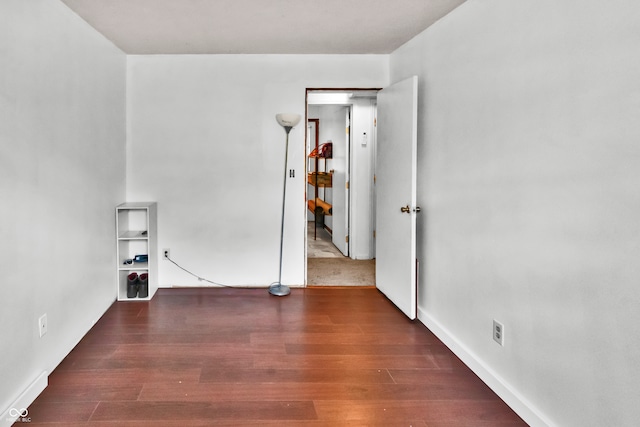 empty room featuring dark hardwood / wood-style floors