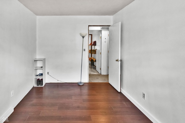 empty room featuring wood finished floors