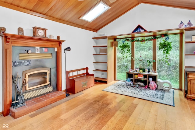 interior space with hardwood / wood-style flooring, lofted ceiling with skylight, and wood ceiling