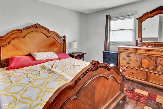 bedroom featuring dark wood-type flooring