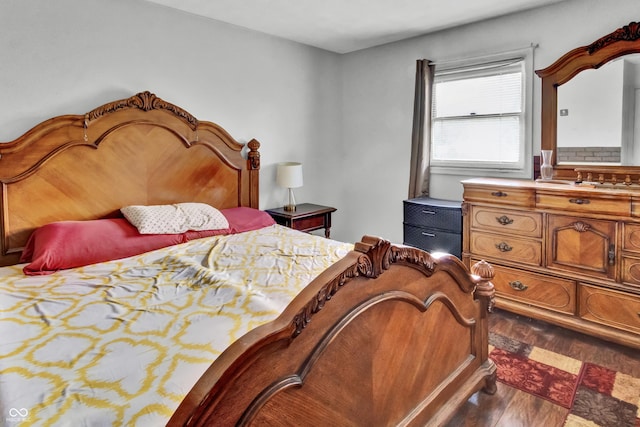 bedroom with wood finished floors