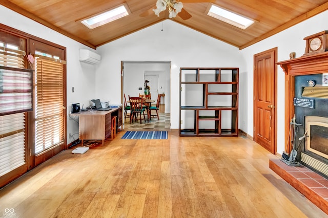 interior space with a wall mounted air conditioner, light hardwood / wood-style floors, and wood ceiling