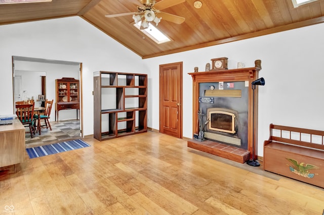 living room with wooden ceiling, vaulted ceiling, wood finished floors, and ceiling fan