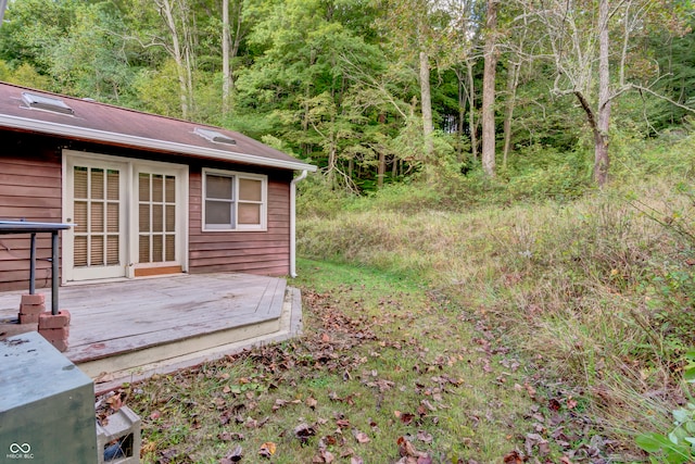 view of yard with a wooden deck