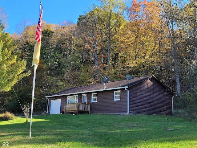 back of house featuring a yard