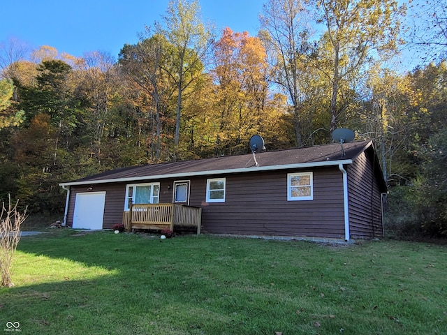 rear view of house featuring a yard