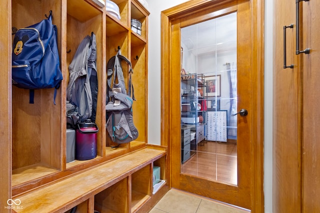 mudroom with light tile patterned floors