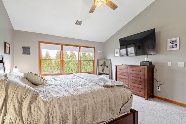 bedroom featuring ceiling fan, light colored carpet, and lofted ceiling