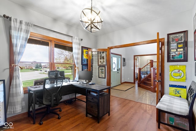 office with a notable chandelier and hardwood / wood-style floors