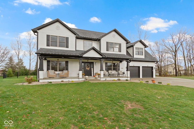 view of front facade featuring covered porch, a front yard, and a garage