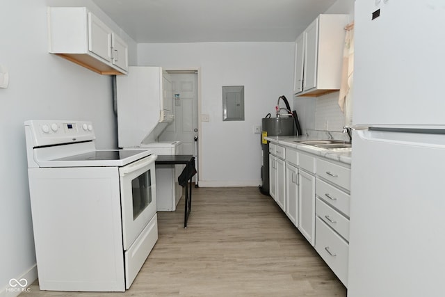 kitchen with sink, light hardwood / wood-style flooring, electric panel, white appliances, and white cabinets