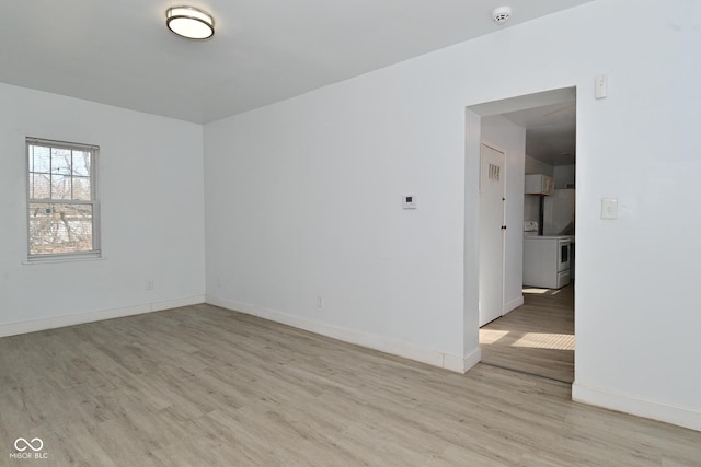 spare room featuring light hardwood / wood-style flooring