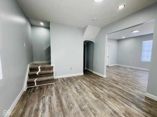 unfurnished living room featuring hardwood / wood-style floors