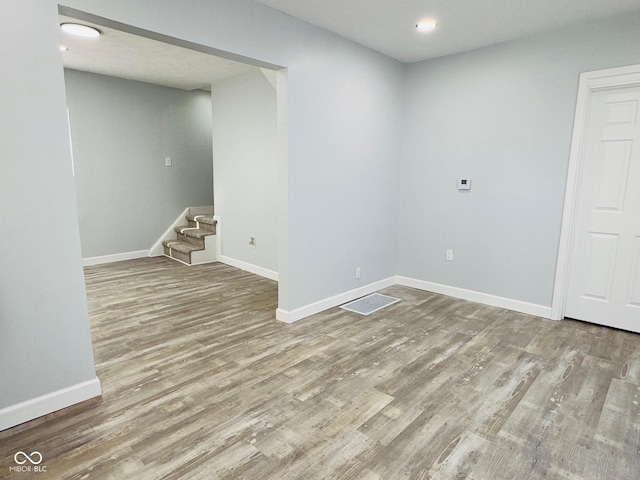 spare room featuring hardwood / wood-style flooring