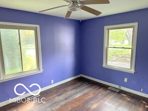 spare room featuring ceiling fan and hardwood / wood-style floors