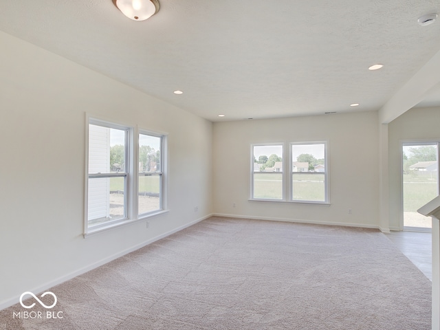 empty room featuring light colored carpet