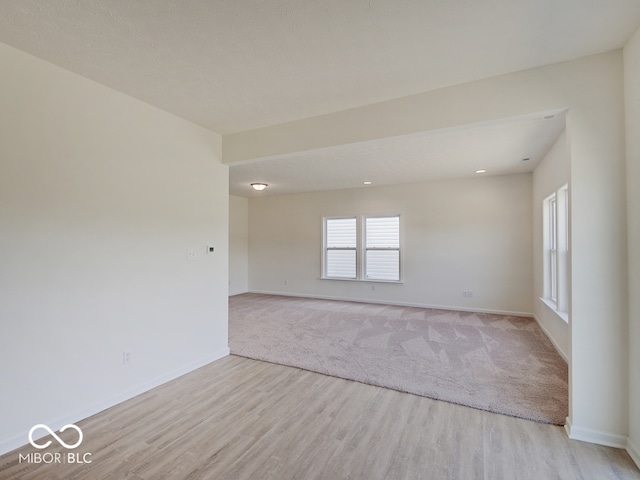 spare room featuring light hardwood / wood-style flooring