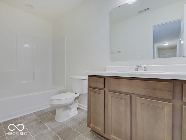 full bathroom with vanity, toilet, and  shower combination