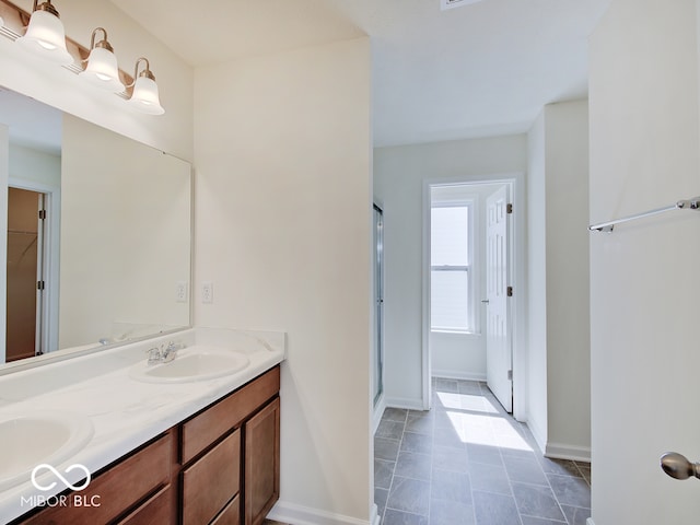 bathroom with vanity and walk in shower