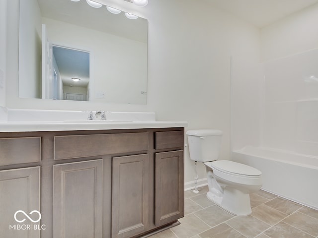 full bath with toilet, vanity, baseboards, tub / shower combination, and tile patterned floors