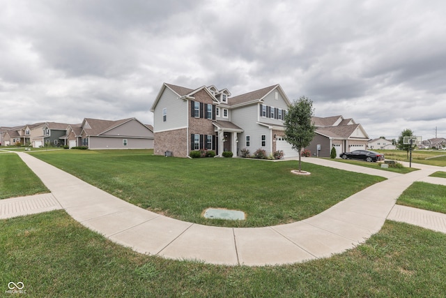 view of front of house with a front lawn and a garage