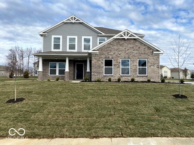 craftsman-style home featuring a front yard