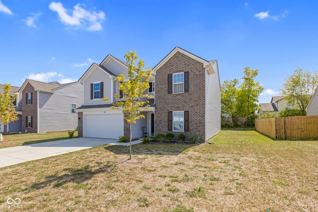 view of front property featuring a garage and a front yard