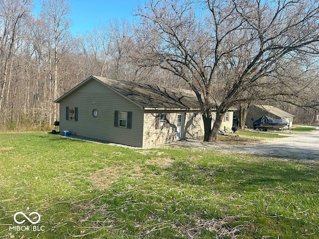 view of property exterior featuring a lawn