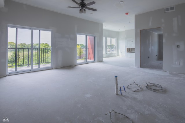 unfurnished room featuring visible vents and a ceiling fan