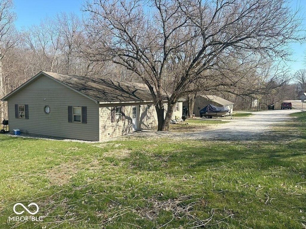 view of property exterior with a yard