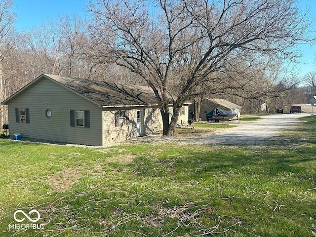 view of property exterior with a yard