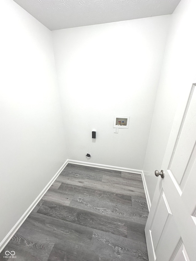 washroom with wood-type flooring and hookup for a washing machine