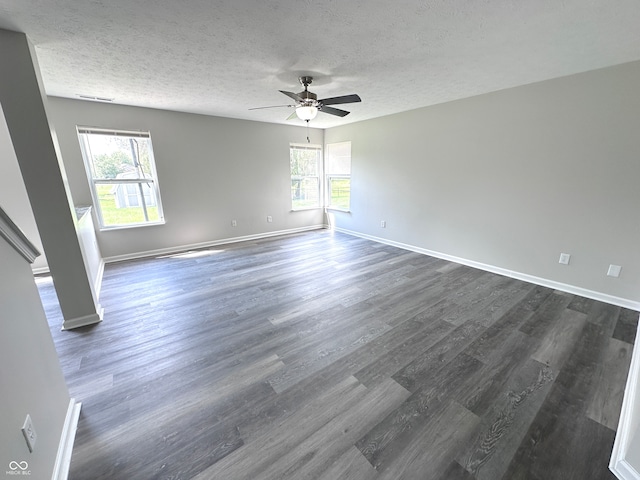 spare room with ceiling fan, hardwood / wood-style flooring, and a textured ceiling