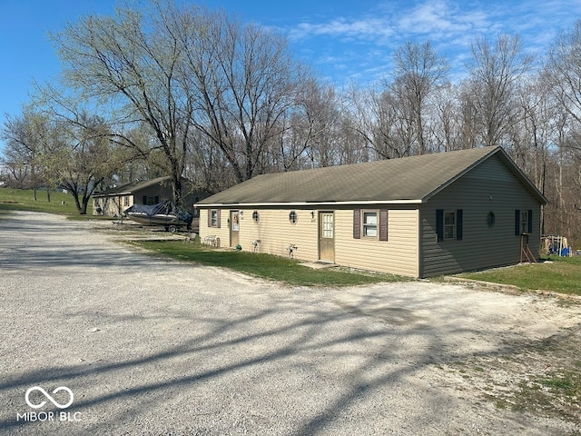 view of side of home featuring a yard