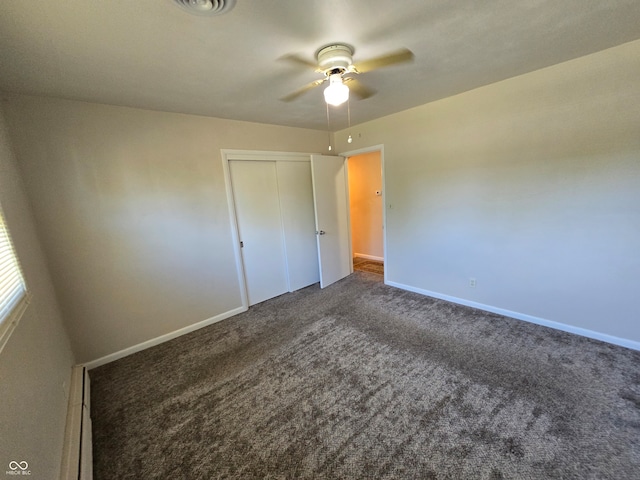 unfurnished bedroom with ceiling fan, carpet, and a closet