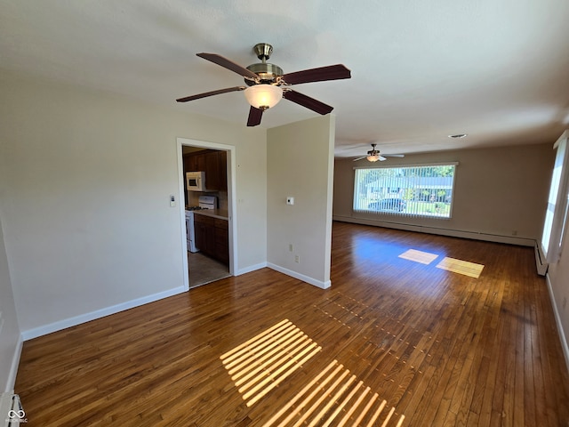 spare room with ceiling fan, hardwood / wood-style floors, and a baseboard radiator