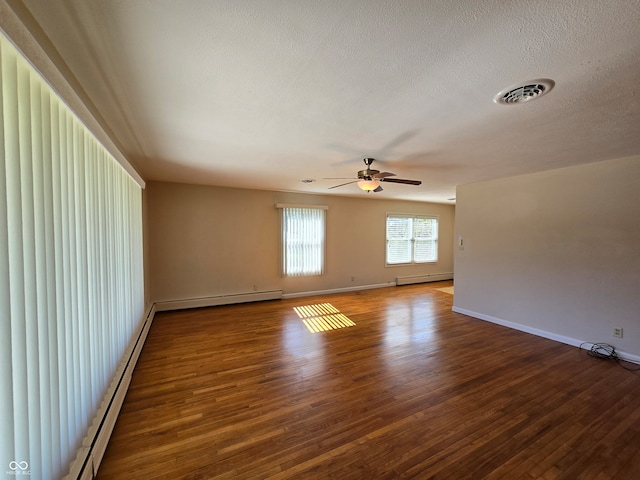 unfurnished room featuring hardwood / wood-style floors, a baseboard heating unit, ceiling fan, and a textured ceiling