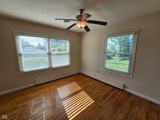 unfurnished room featuring ceiling fan, a baseboard radiator, wood-type flooring, and plenty of natural light