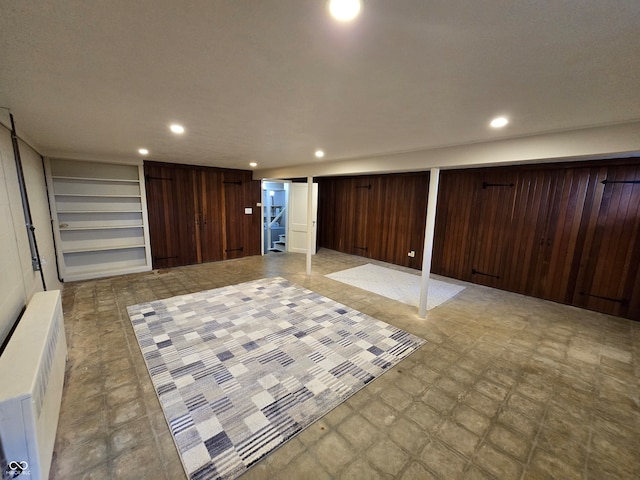 basement featuring light tile patterned floors