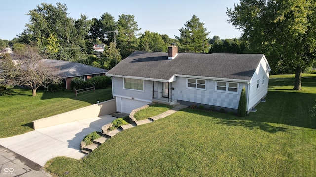 view of front of property featuring a garage and a front lawn