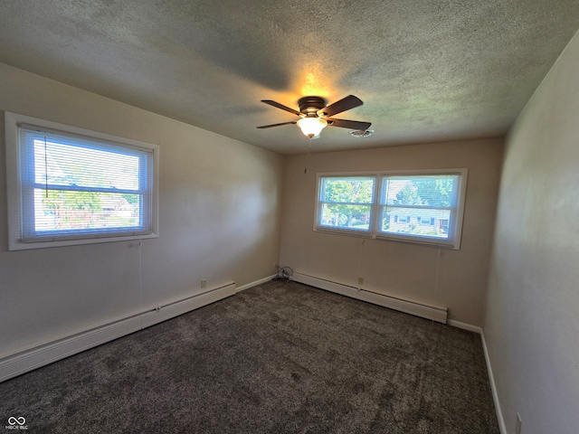 unfurnished room with a wealth of natural light, carpet floors, and a baseboard radiator